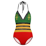 A Rastafari one-piece bikini is inspired by the Rastafari movement, which originated in Jamaica. It typically features the colors of the Ethiopian flag - red, green, and gold - which are associated with Rastafarian culture. The design often includes bold stripes or patterns in these colors.  The Rastafari one-piece bikini is a vibrant and expressive swimwear choice that represents the Rastafarian movement and its values of unity, spirituality, and African heritage. 