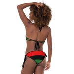 The Pan African bikini typically features the three colors Red, Black and Green that represents African culture, heritage, pride and unity. The overall style of a Pan African bikini is lively, expressive, and celebrates the rich diversity of African aesthetics.